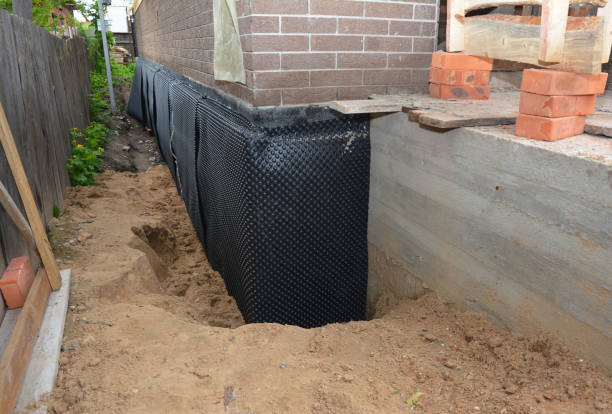 Happy homeowners after waterproofing job in Chilo